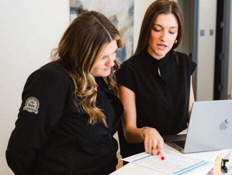 Yoo Direct Health team reviewing comprehensive lab results at the front desk