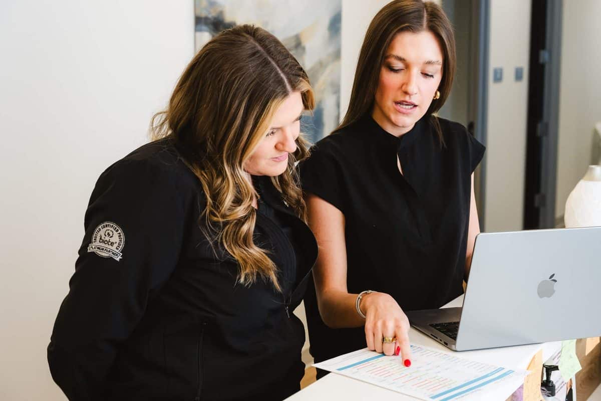 Yoo Direct Health team reviewing comprehensive lab results at the front desk