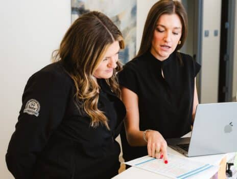 Yoo Direct Health team reviewing comprehensive lab results at the front desk