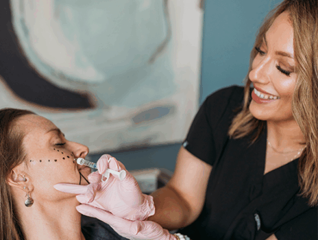 Carmen Puckett, RN CANS Injecting a patient