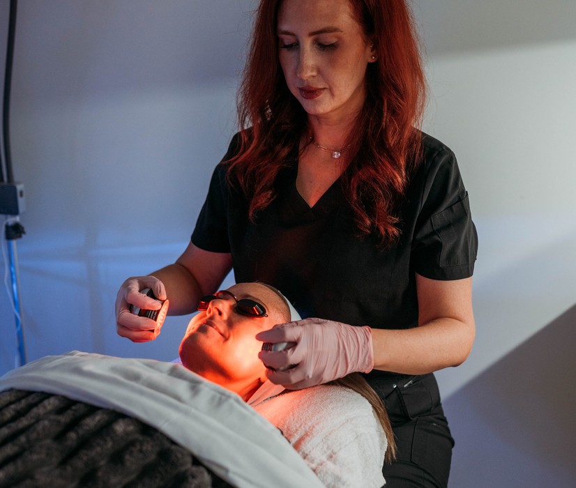 Megan Martin performing an LED light therapy facial at Yoo Direct Health in Noblesville