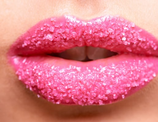 Lips with pink lip stick coated in sugar